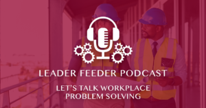 Employees talking to problem solve with Leader Feeder Logo overlay