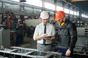 manufacturing leader talking to team member